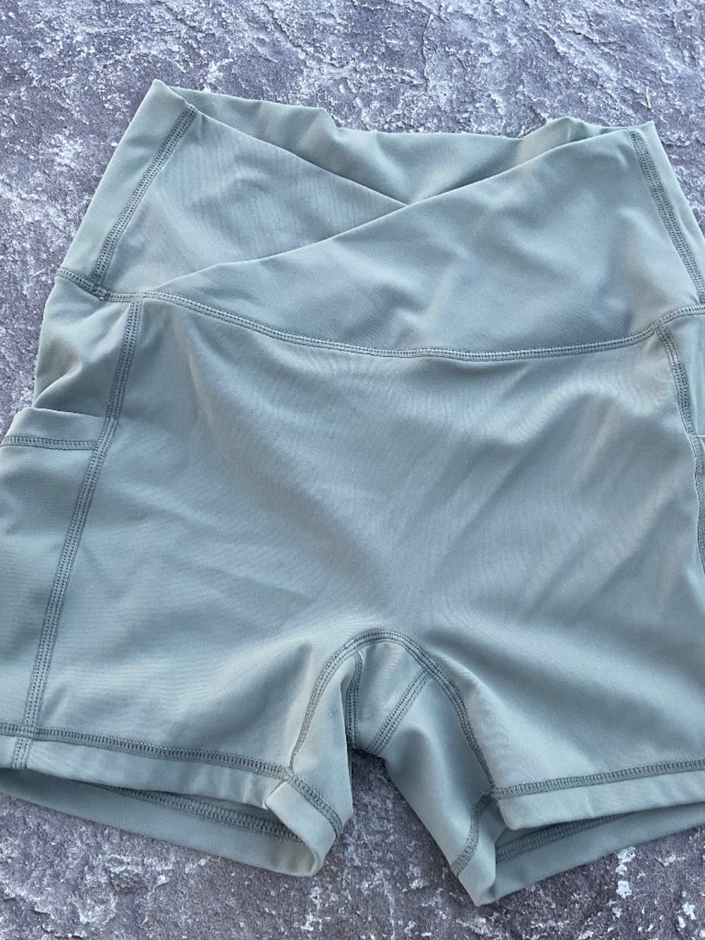 Women’s olive green spandex shorts with pockets size S